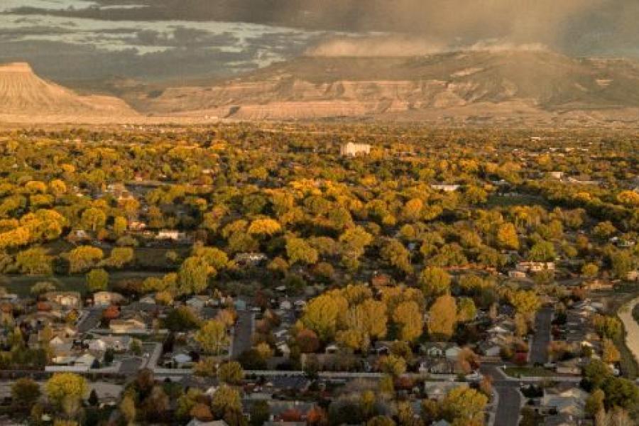 Alpen glow photo of the grand valley looking towards the Mesa and Mt Garfield