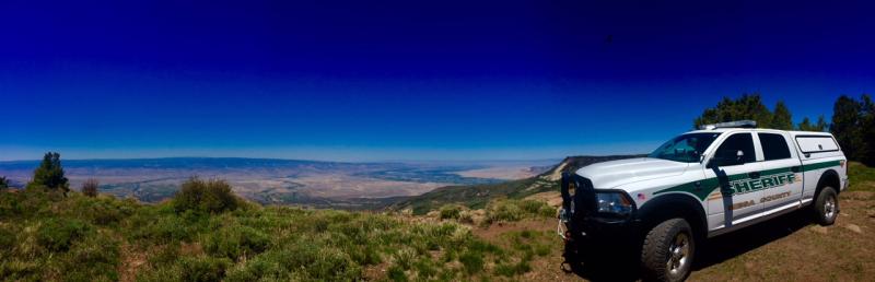 Photograph of Sheriff Vehicle with the Grand Valley in background