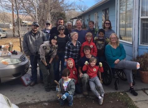 Photograph of Grand Valley Peace and Justice organization teams up with Crime Reduction Unit Deputies.  Shows a group of adults, children and deputies