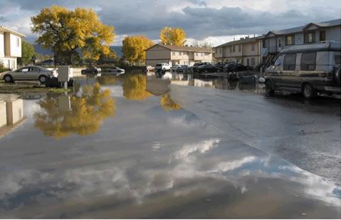 Photograph of Flooded Apartment Complex parking lot