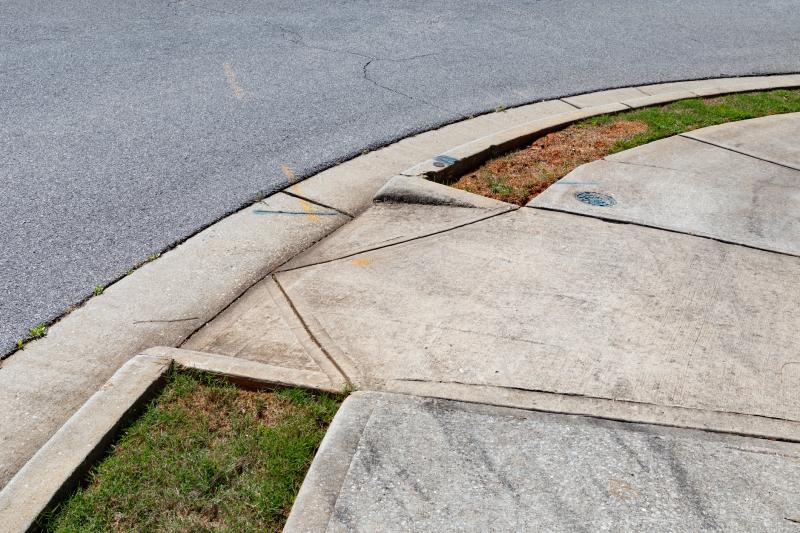 Photograph of Asphalt street -concrete sidewalk - grass area