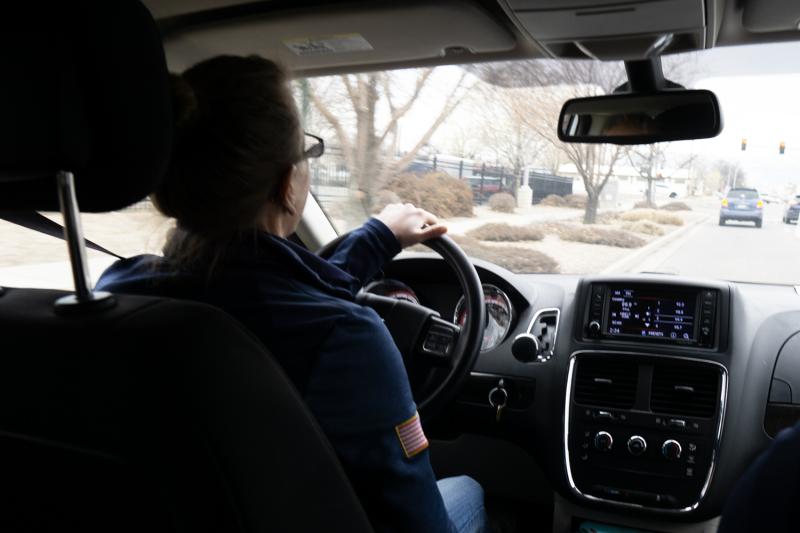 A CJO driving a County vehicle