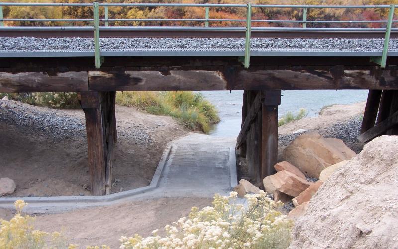 Entry to the boat ramp with a railroad bridge above it