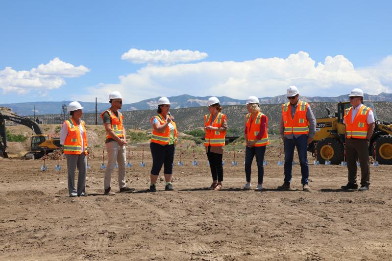 Officials break ground on community hall.