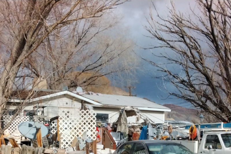 Yard with junk in it.