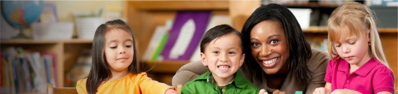 Image of 3 children with childcare provider.