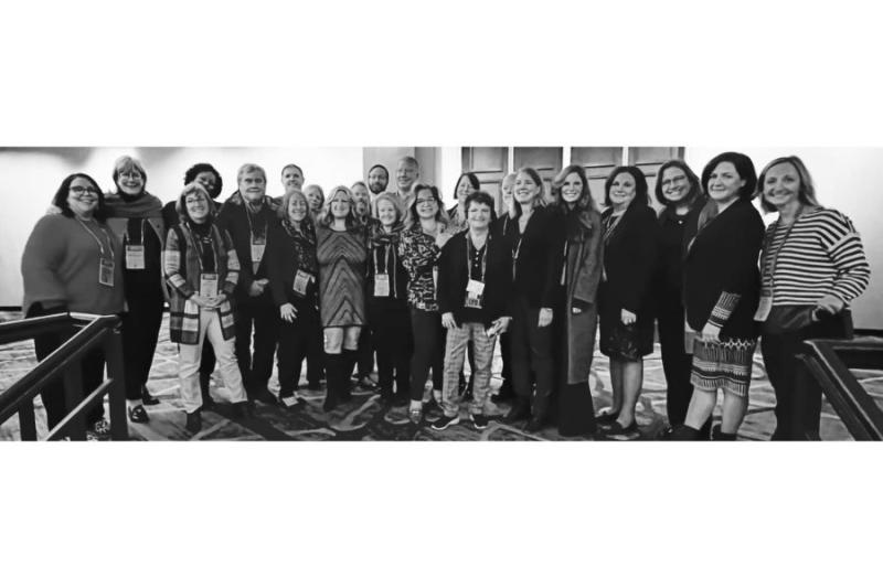 Black and white photo of large group of government officials. 