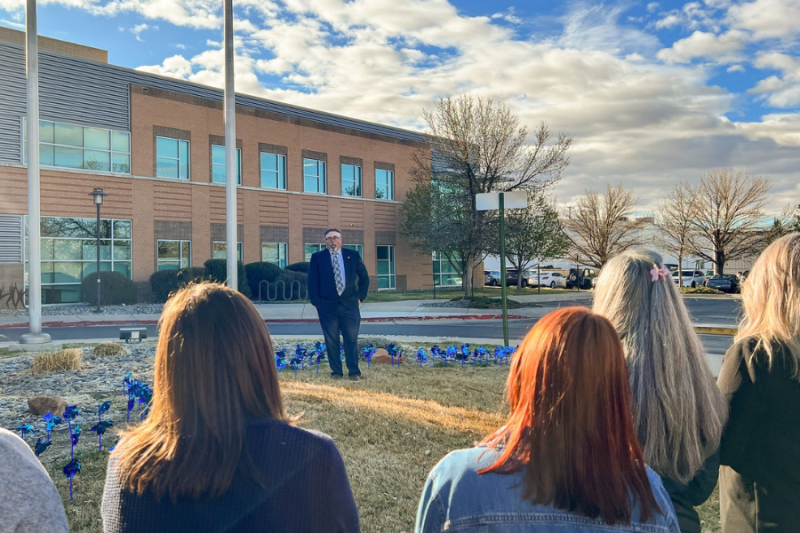 Joe Kellerby, MCDHS Director of Child Welfare and Adult Protection, gives a speech at the pinwheel planting