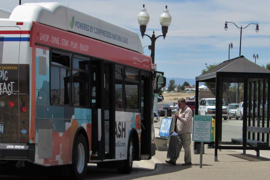 Bus rider boards the Grand Valley Transit DASH Bus at the airport. 