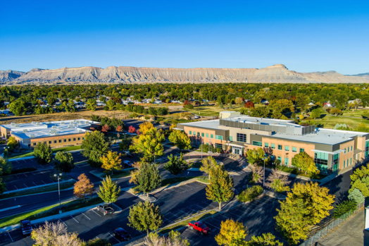 Arial view of the Community Services Campus with the parking lot and trees.