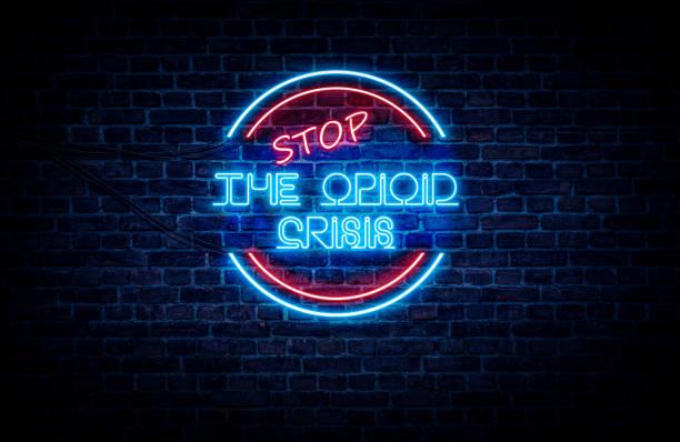 Brightly colored neon sign that reads "Stop the Opioid Crisis"