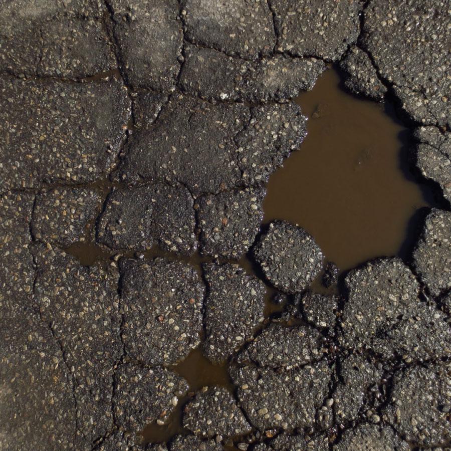 Photograph of a pothole in a street